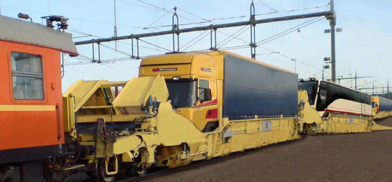 Interwagon civil wagon loaded with trucks on the rail track