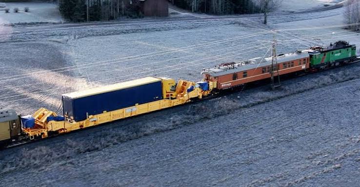 Aerial view of an Interwagon rail wagon train in a snowy landscape